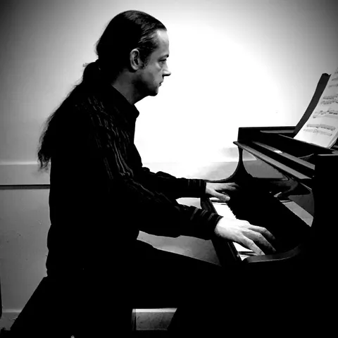 Gabriel Keen playing piano